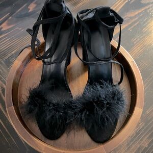 Black feather strapped heels.